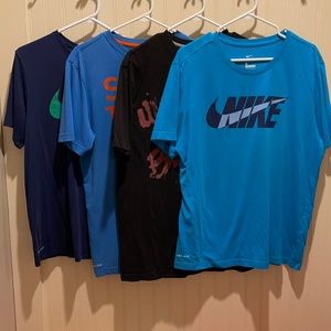 Lot of 4 men’s Nike Large shirts.